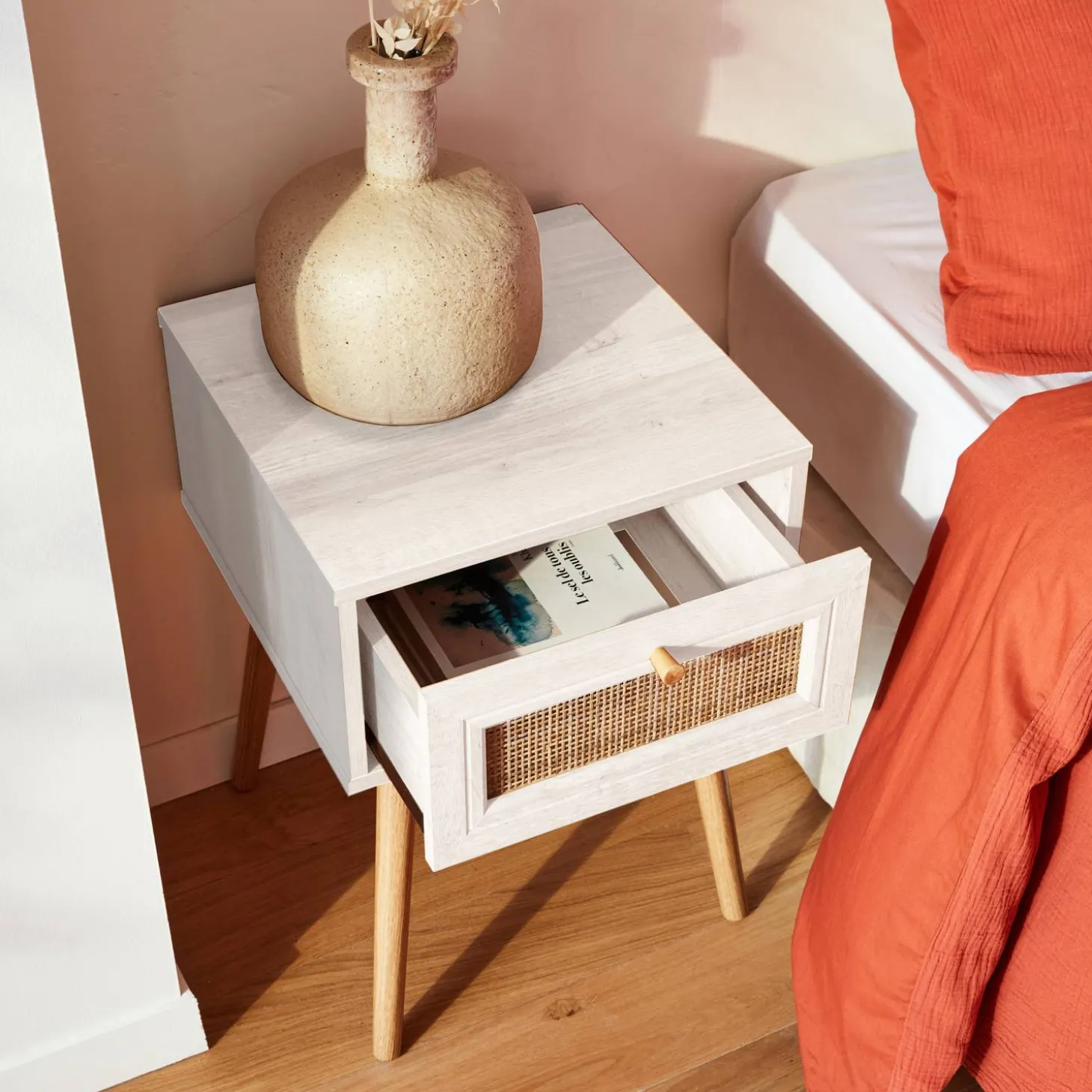 Woven rattan bedside table with drawer